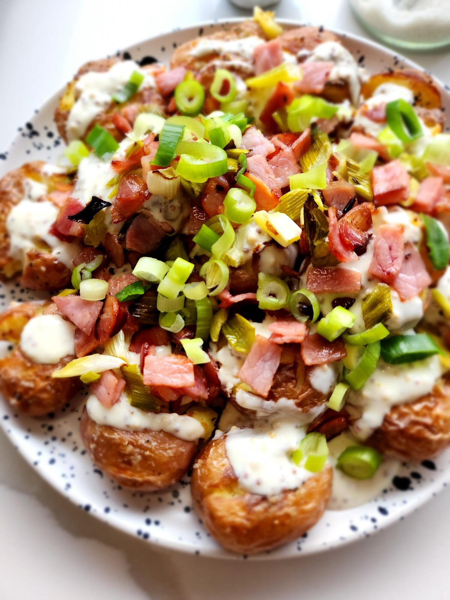 close up of smashed potatoes dish